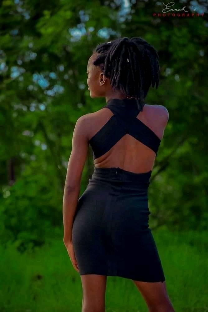 Jacqueline Mwamba, steps on necks with an open back bodycon rocked