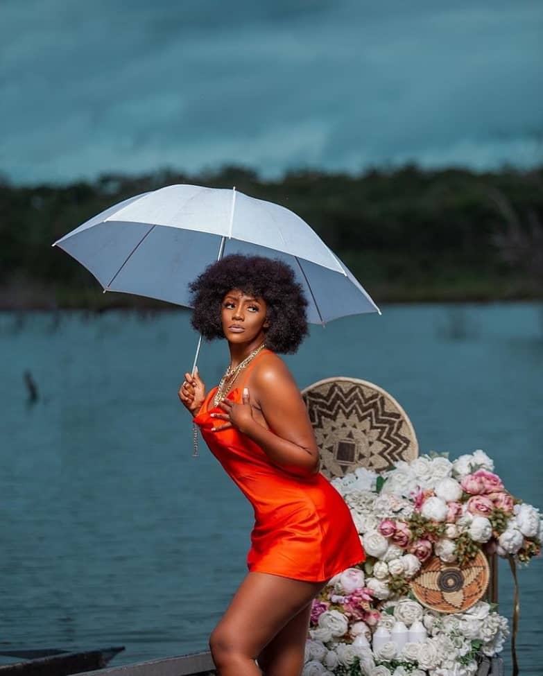 Christina Tintin Sakala in orange short dress