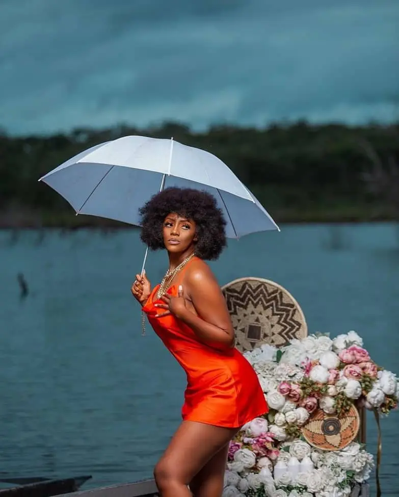 Christina Tintin Sakala in orange short dress