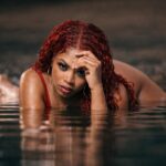 Velnera Solis: The Beauty & Music Star Everyone Craves Velnera Solis Gaze reflected in dark waters