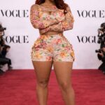 Spring Fashion 2026 Trends for Women: The Elevated Feminine Era Beautiful Badgyal Nera - Woman wearing structured floral corset two-piece set on red carpet showcasing Spring 2026 fashion trends for women