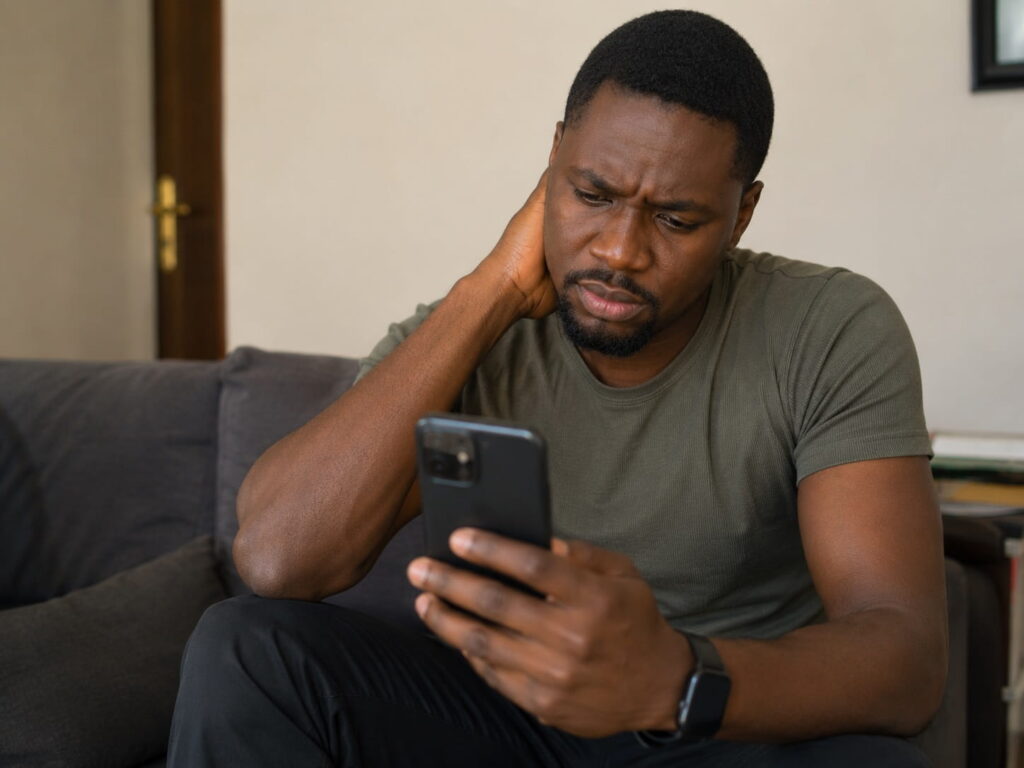 Zambian man checking why his Zamcash loan application was rejected